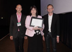 Kathleen McLoughlin with presentation co-chairs: Carlo Leget (right) and Ole Råkjaer