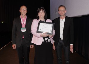 Kathleen McLoughlin with presentation co-chairs: Carlo Leget (right) and Ole Råkjaer