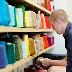 Students in connect lecturer Emelia Haglund's Textile Design: Weaving I program make color options from a wall of hue-organized bond options in a design studio in School of Human Ecology, which can be housed into the newly renovated Nancy Nicholas Hall in the University of Wisconsin-Madison, on Sept. 10, 2012. (picture by Bryce Richter / UW-Madison)