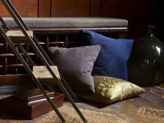 modern gray, blue, and gold pillows by Knoll